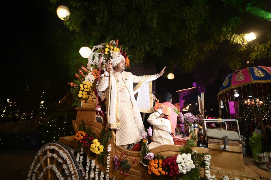 groom dancing and celebrating photographed by candid wedding photographer in Faridabad