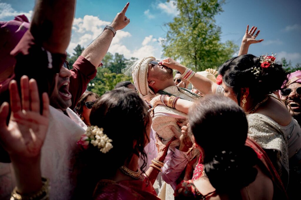 candid moment of groom shot by a wedding photographer in faridabad