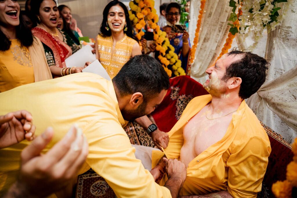 groom's friends having fun at haldi ceremony