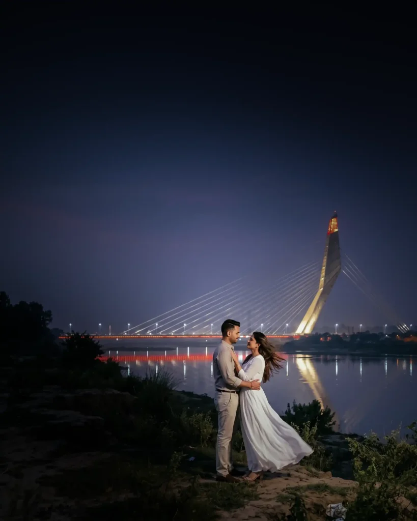 Couple standing under  Signature Bridge during a cinematic night pre wedding shoot