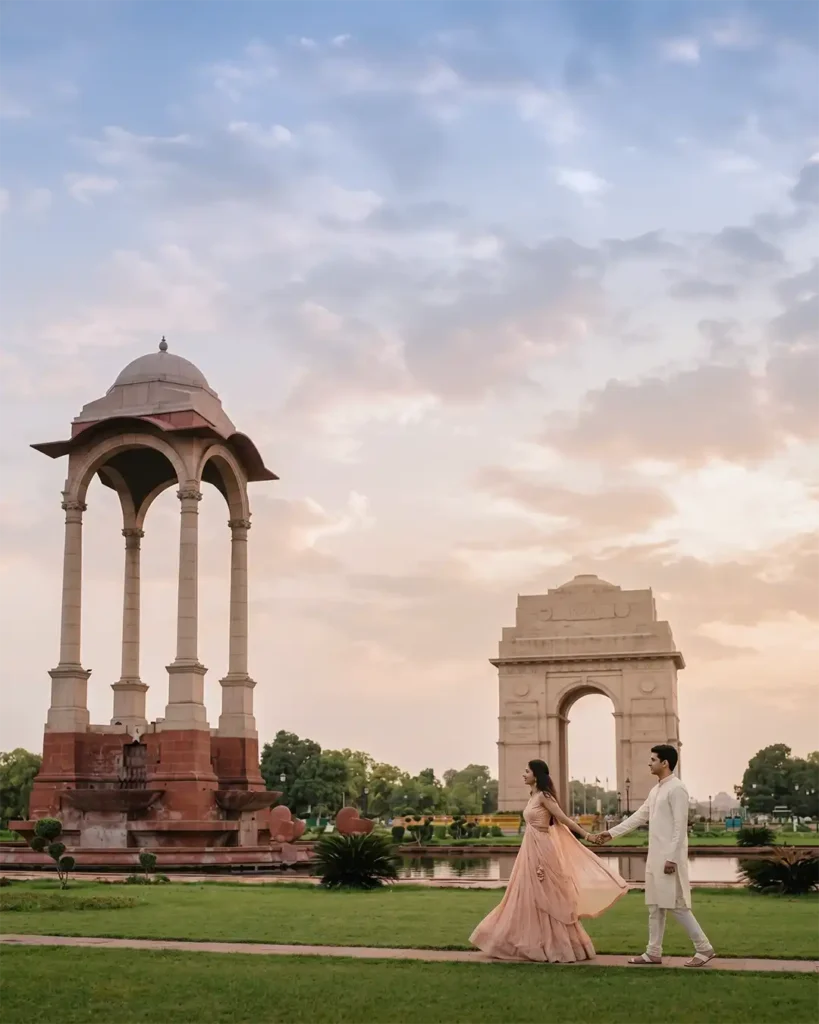 Couple walking hand in hand near India Gate during a cinematic pre wedding shoot in Delhi