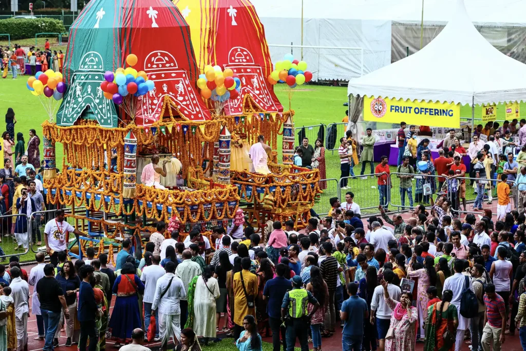 Devotees participate in the Jagannath Rath Yatra at Toa Payoh Stadium in Singapore in 2023.