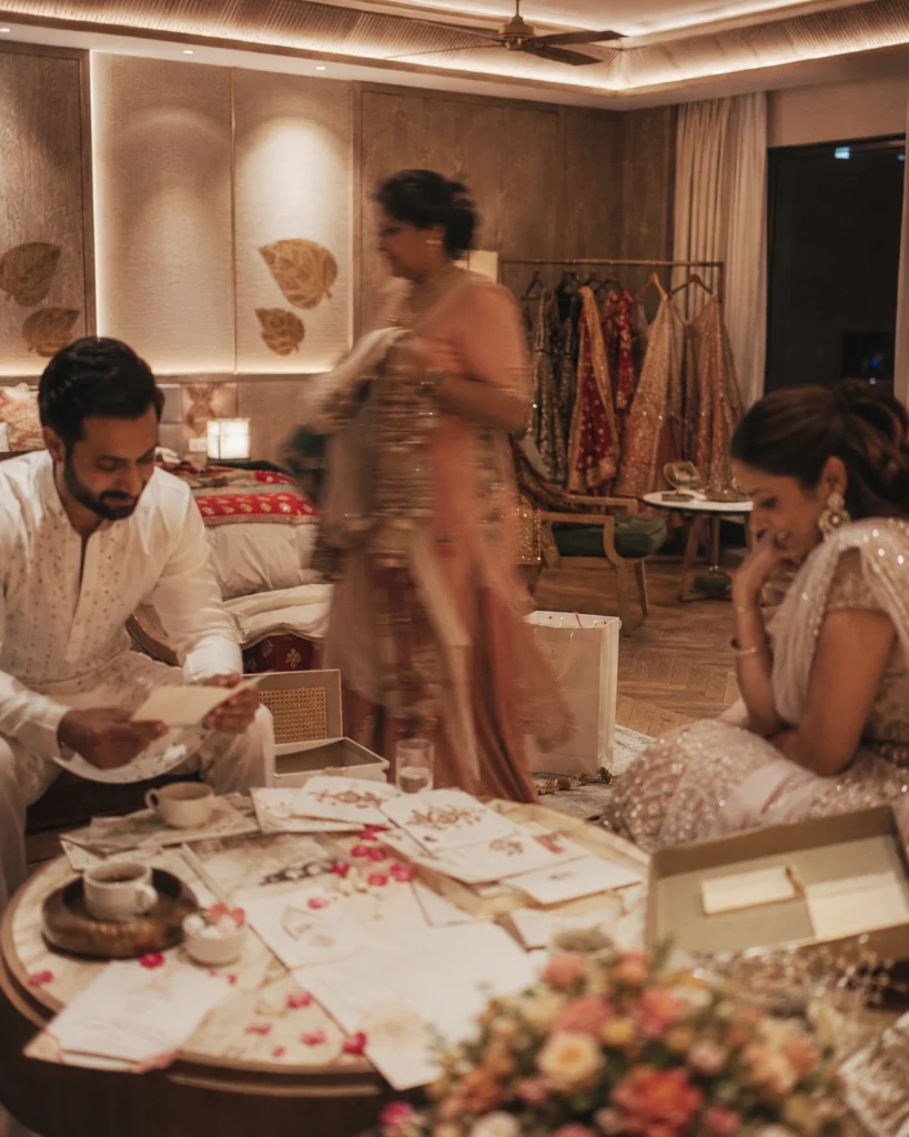 Bride and groom sitting quietly planning a wedding, inside a softly lit wedding suite