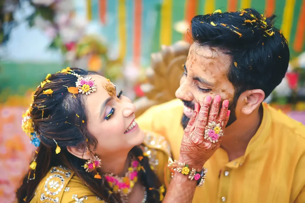 Bride and groom sharing a candid moment during a haldi ceremony photographed in Aligarh.