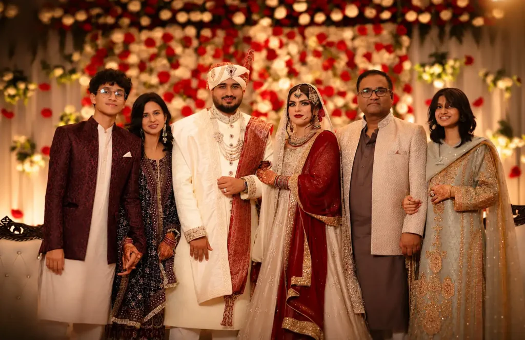 Family members sharing a moment together during Zobia and Qutub's wedding at Fort Royale in Aligarh.