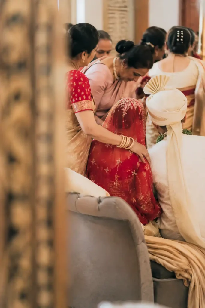 Family members sharing a quiet moment together during an Indian wedding