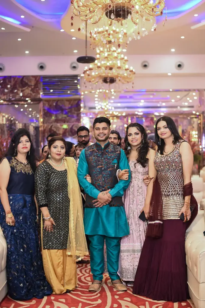 Family members posing together during a wedding celebration at Klyde Banqueting Suite Faridabad