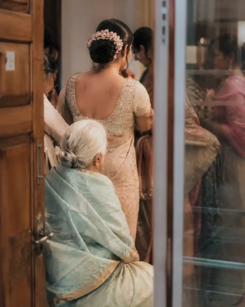 Family members sharing a quiet moment during an Indian wedding celebration