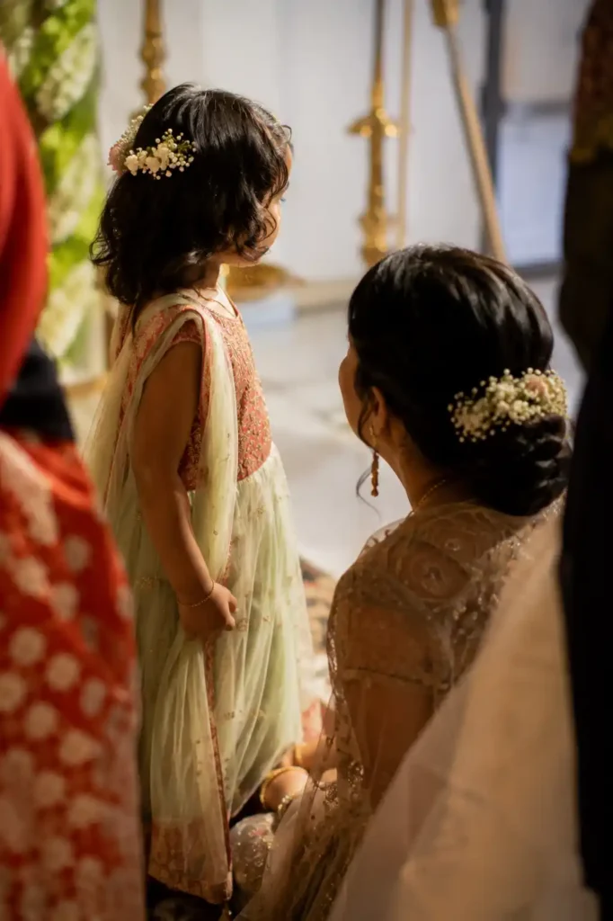 Family members sharing a quiet moment during an Indian wedding celebration