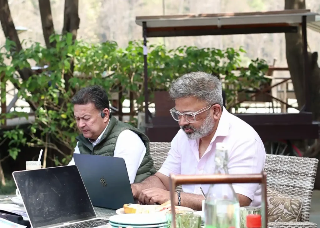 Production planning and creative coordination meeting for Ragas by the River involving organizers and visual storytelling teams.