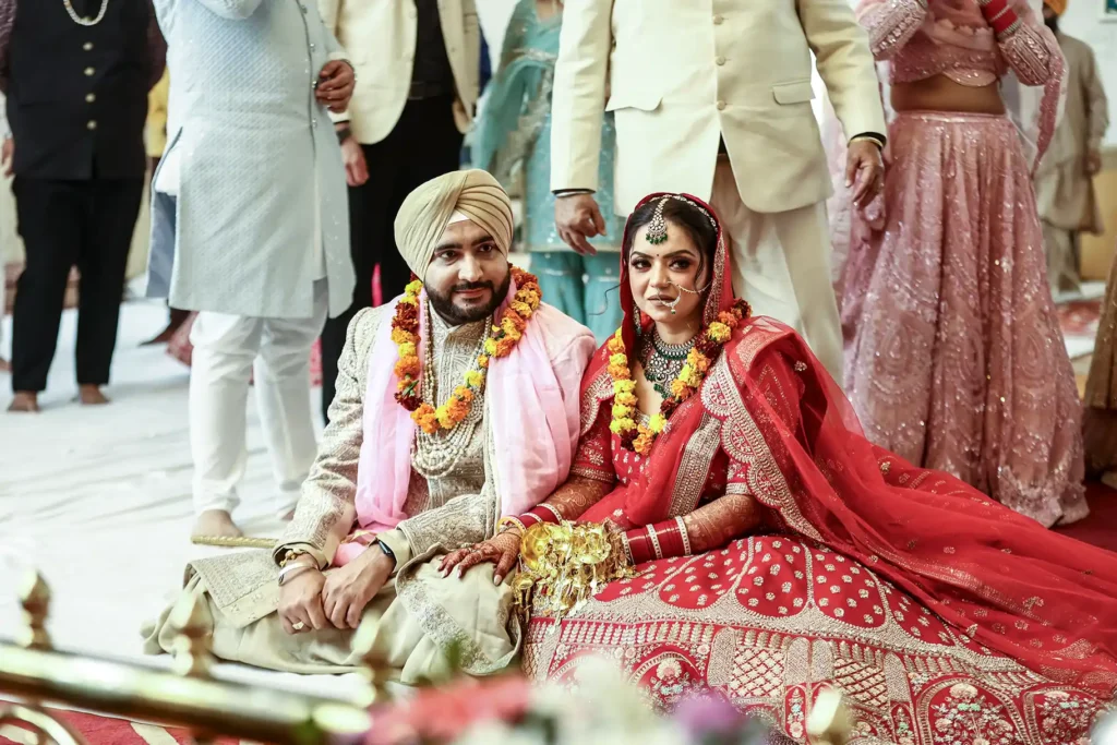 Bride and groom during the Anand Karaj ceremony at Gurudwara Pahari Wala, Greater Kailash, New Delhi