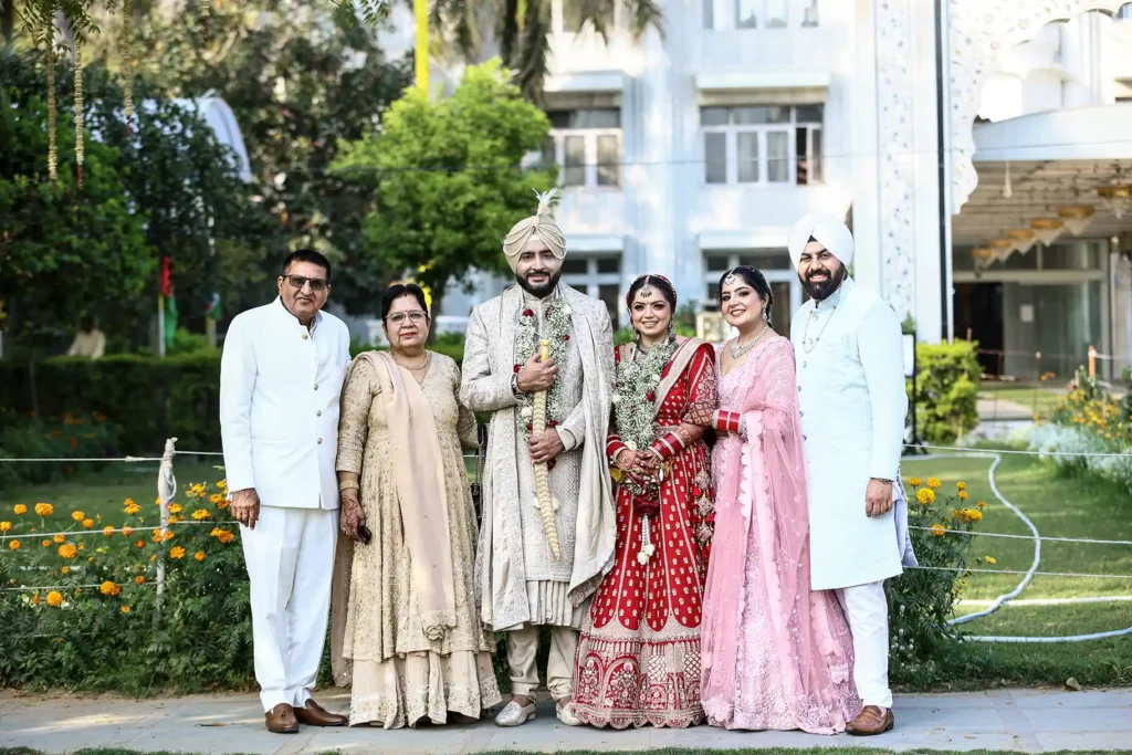 Bride and groom with family members after the Anand Karaj ceremony in New Delhi