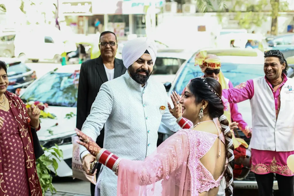 Family members celebrating during a Sikh wedding at Gurudwara Pahari Wala
