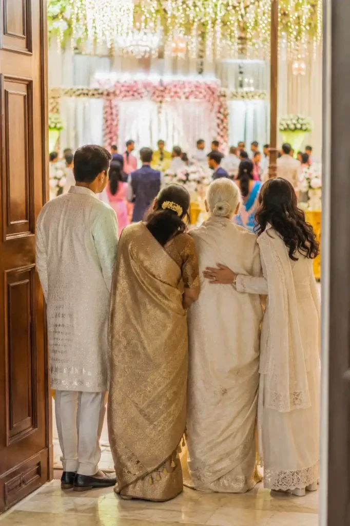 Family members together during a quiet moment at an Indian wedding
