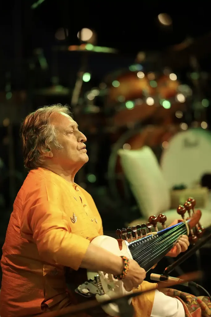 Ustad Amjad Ali Khan performing at Ragas by the River, photographed by Asad Ansari during the festival's celebration of Indian classical music.